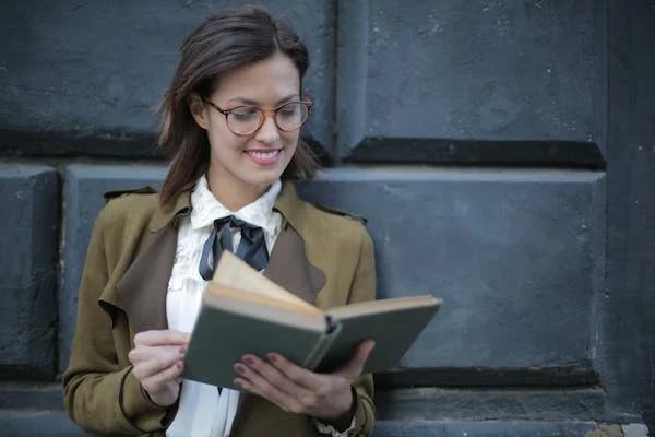 Woman reading a book - a symbol of self-development