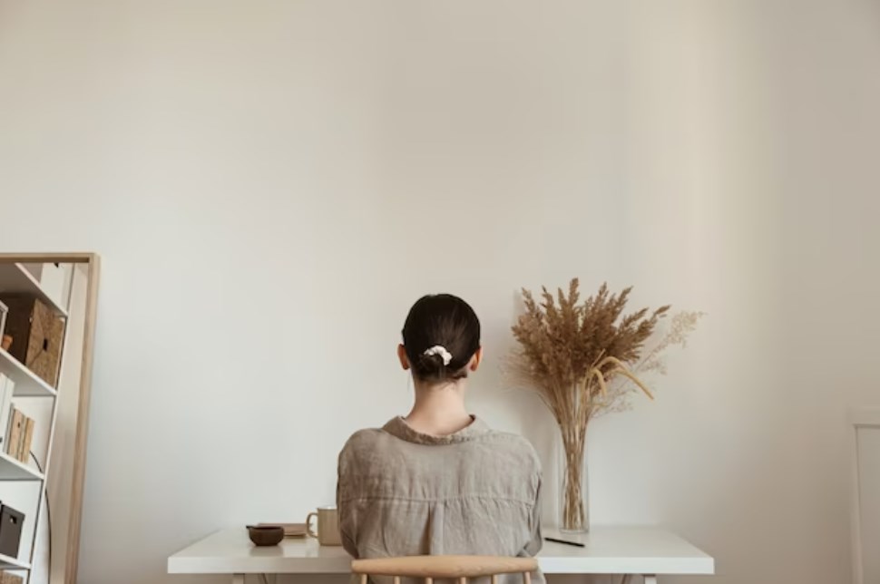 a girl working at home with minimalistic design interior