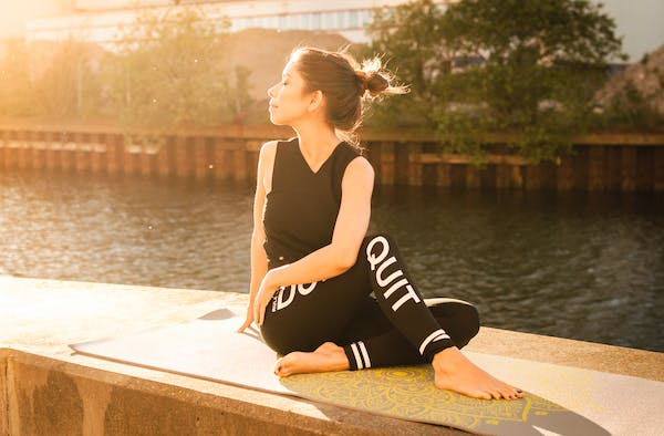 A serene setting with a person meditating in a peaceful environment