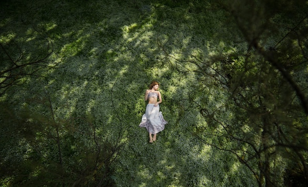 A person surrounded by nature, symbolizes self-reflection and personal growth