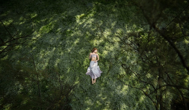 A person surrounded by nature, symbolizes self-reflection and personal growth